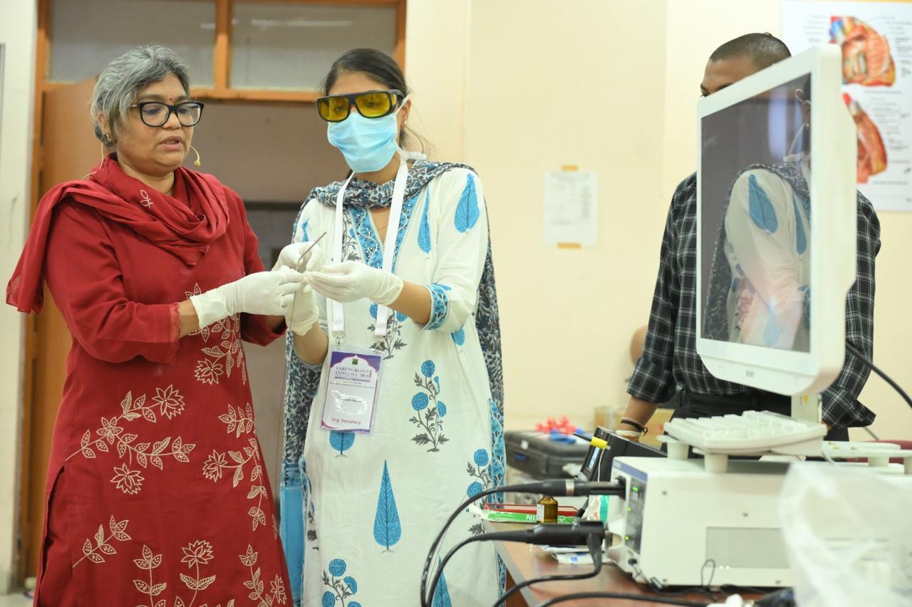 dr payal kumbhat teaching surgical monitor red dress